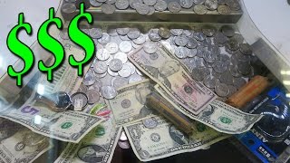 There is so much money in this coin pusher! There is so much money in this coin pusher!