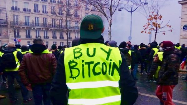 Anti-euro bitcoin art pops up in paris amid protests Anti-euro bitcoin art pops up in paris amid protests