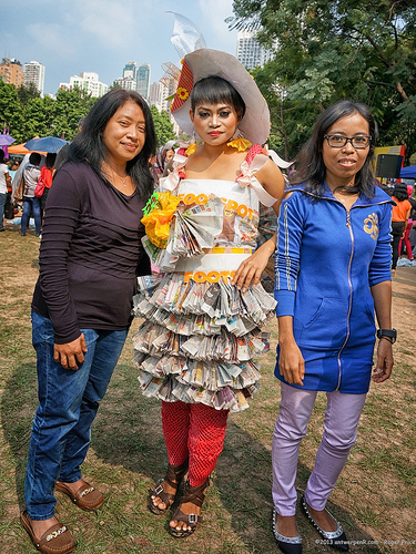 She seems to be dressed in shopping bags and newspaper Tags